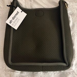Ahdorned perforated neoprene cross body bag